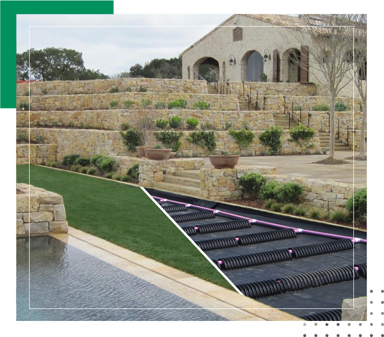 A picture of the back yard with a pool and water features.