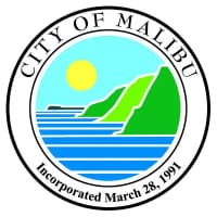 A city of malibu logo with the sun setting in the background.