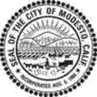 A black and white image of the seal of modesto, california.