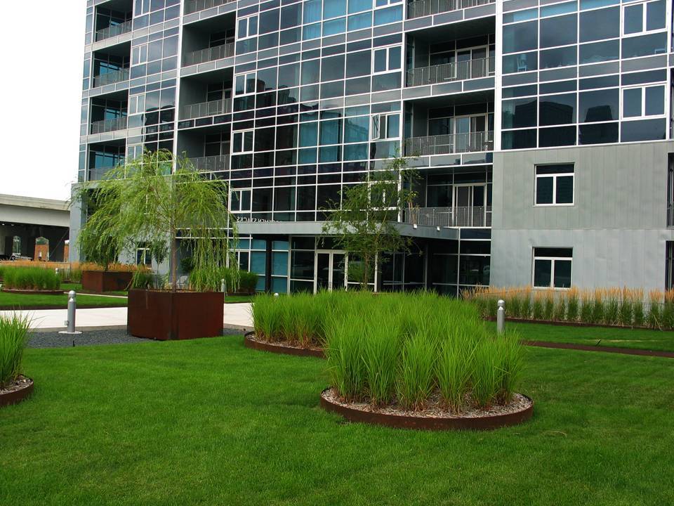 Modern apartment building with landscaped gardens.
